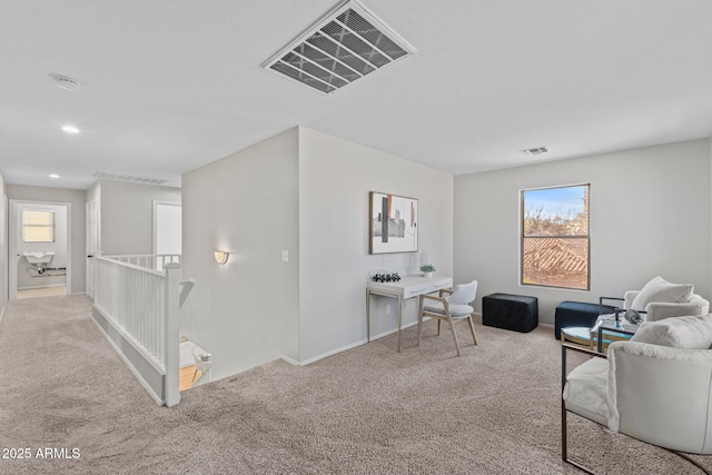 interior space with a wealth of natural light and light colored carpet