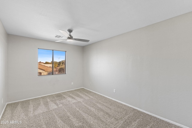 spare room featuring carpet flooring and ceiling fan