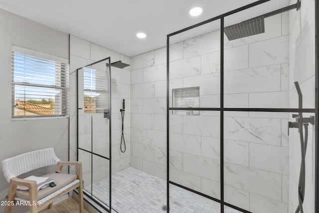 bathroom with a tile shower