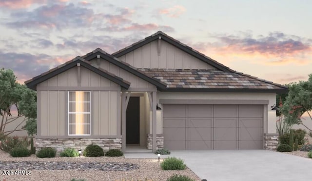 40000 W Bunker Dr, Maricopa, AZ 85138 - view of front of property with stone siding, a garage, driveway, and board and batten siding