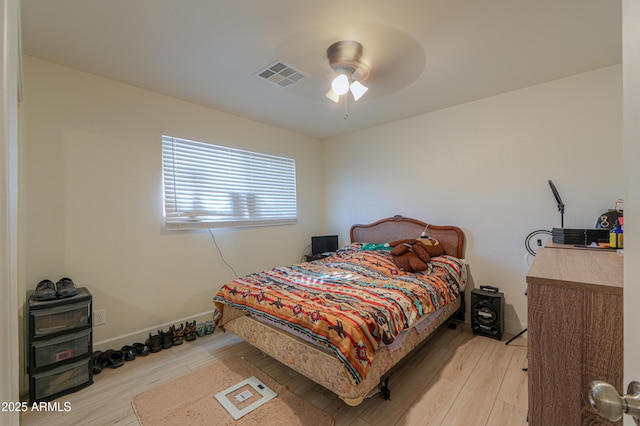 bedroom featuring ceiling fan and light hardwood / wood-style flooring