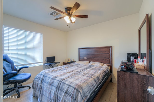 bedroom featuring ceiling fan and light hardwood / wood-style flooring