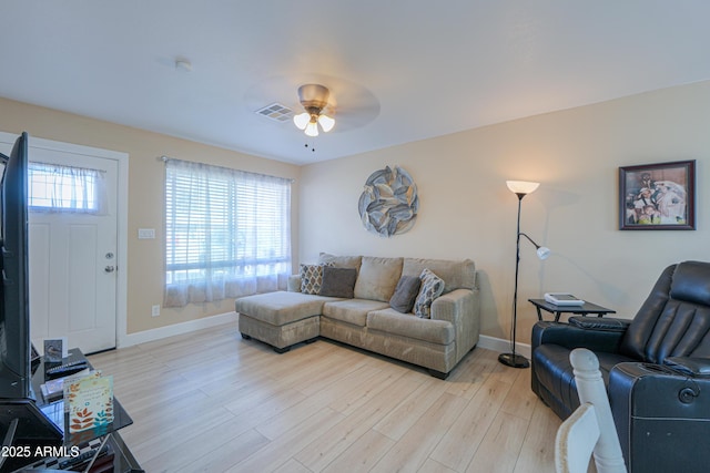 living room featuring ceiling fan and light wood-type flooring