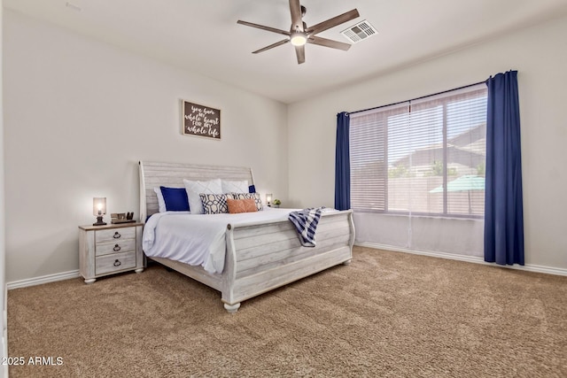 bedroom with carpet flooring, baseboards, and a ceiling fan