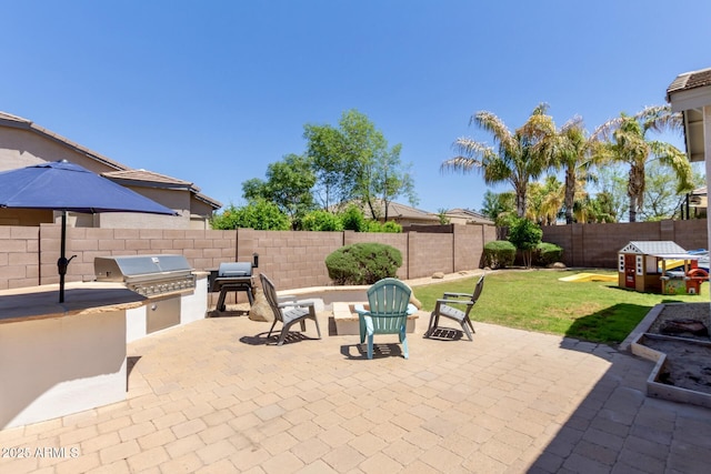 view of patio / terrace featuring exterior kitchen and grilling area