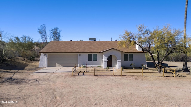 ranch-style home with a garage