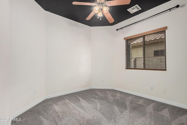 carpeted spare room featuring a ceiling fan, baseboards, and visible vents