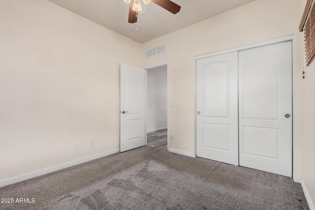 unfurnished bedroom with visible vents, baseboards, ceiling fan, carpet flooring, and a closet