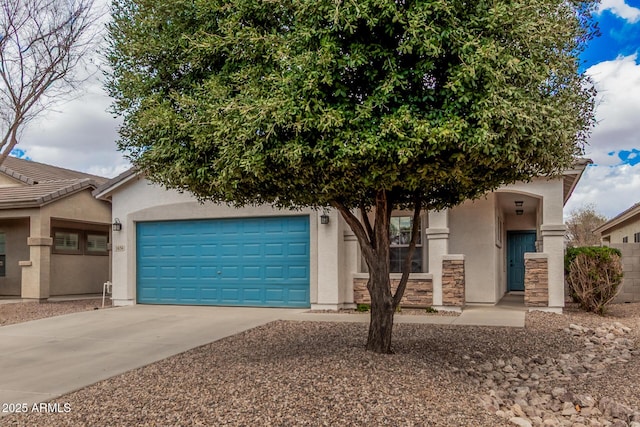 view of front of house featuring stone siding, stucco siding, driveway, and an attached garage