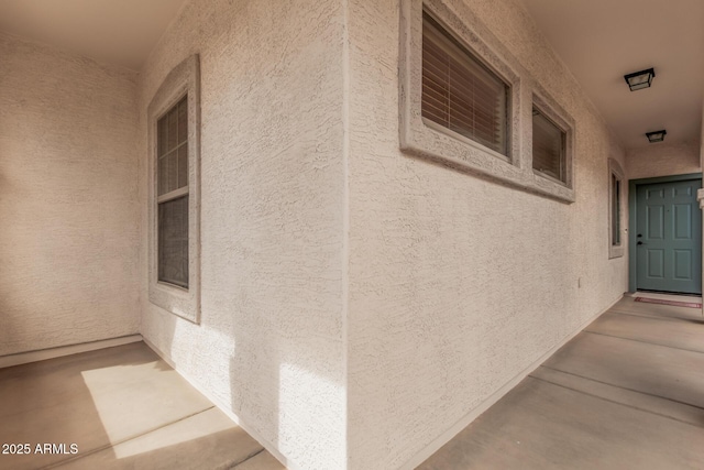 doorway to property with stucco siding