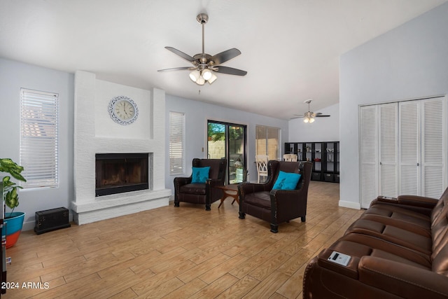 2154 E Forge Ave, Mesa, AZ 85204 - living room with ceiling fan, light wood-type flooring, lofted ceiling, a fireplace, and baseboards