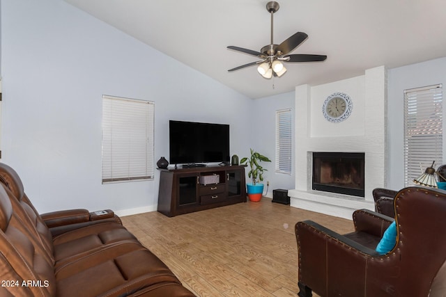 2154 E Forge Ave, Mesa, AZ 85204 - living room featuring vaulted ceiling, ceiling fan, wood finished floors, a brick fireplace, and baseboards