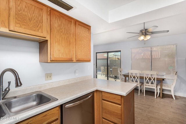 2154 E Forge Ave, Mesa, AZ 85204 - kitchen featuring stainless steel dishwasher, a sink, a peninsula, light wood-style flooring, and light countertops