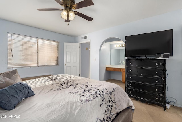 2154 E Forge Ave, Mesa, AZ 85204 - bedroom featuring arched walkways, light colored carpet, a ceiling fan, and ensuite bath