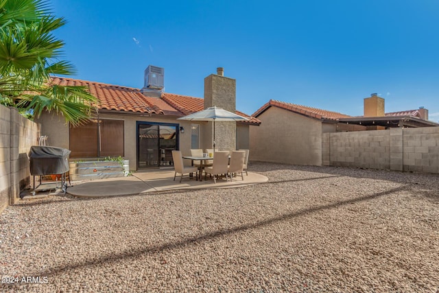 2154 E Forge Ave, Mesa, AZ 85204 - rear view of property with a tile roof, a patio area, stucco siding, cooling unit, and a chimney