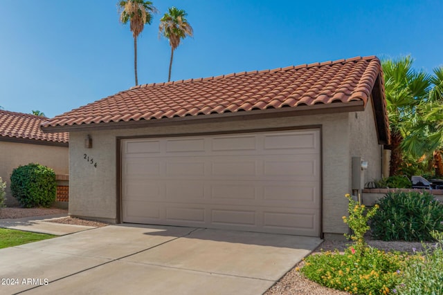 2154 E Forge Ave, Mesa, AZ 85204 - mediterranean / spanish-style home with stucco siding, concrete driveway, a garage, and a tiled roof