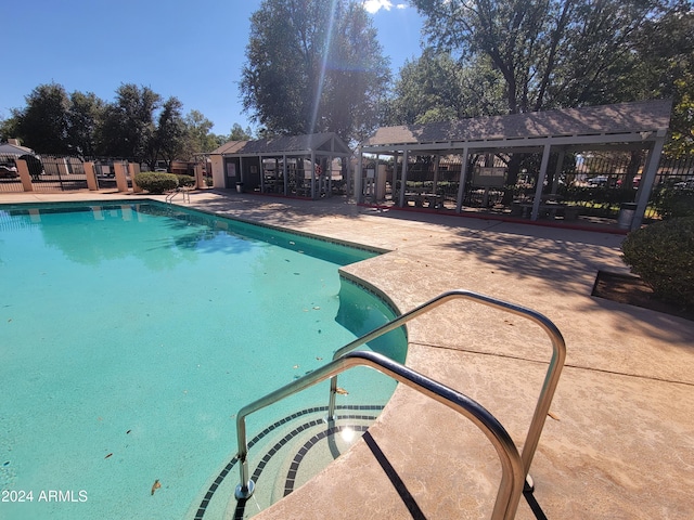 view of swimming pool featuring a gazebo and a patio