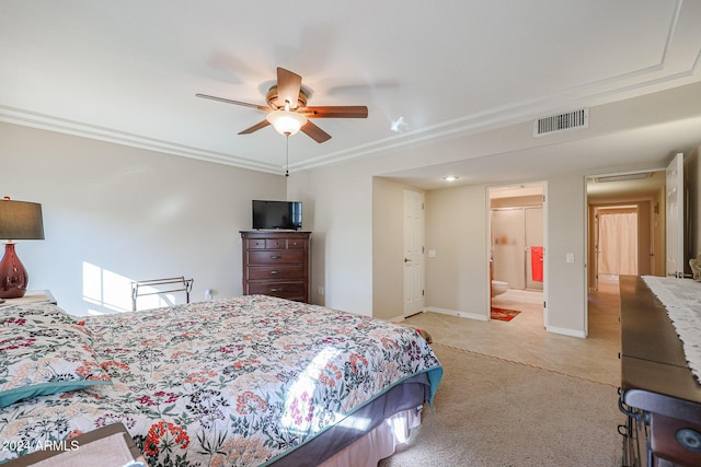 carpeted bedroom with ensuite bathroom, ceiling fan, and crown molding