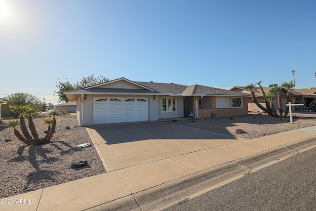 ranch-style house featuring a garage