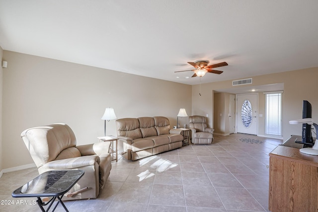 living room featuring light tile patterned floors and ceiling fan