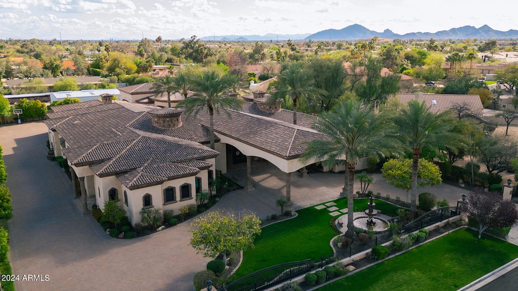 birds eye view of property featuring a mountain view