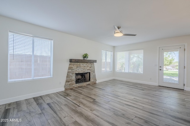31259 N 42nd Pl, Cave Creek, AZ 85331 - unfurnished living room featuring ceiling fan, wood finished floors, and a fireplace