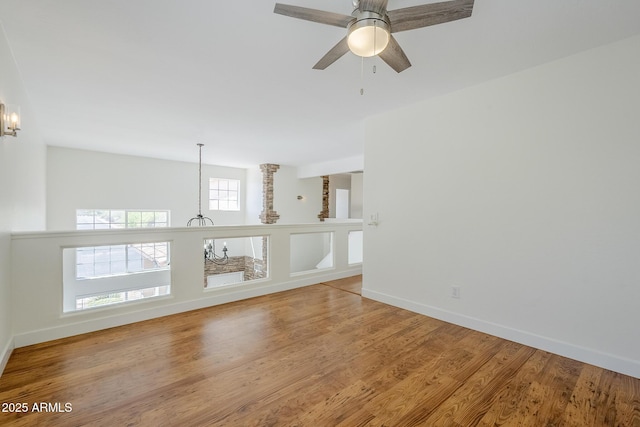 31259 N 42nd Pl, Cave Creek, AZ 85331 - empty room with a chandelier, wood finished floors, and a ceiling fan