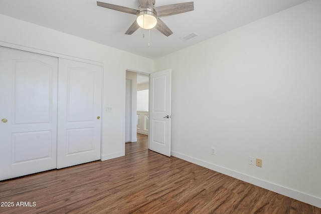 31259 N 42nd Pl, Cave Creek, AZ 85331 - unfurnished bedroom with wood finished floors, a closet, and ceiling fan
