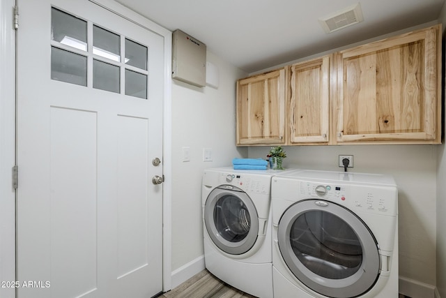 31259 N 42nd Pl, Cave Creek, AZ 85331 - laundry room featuring cabinet space, washer and clothes dryer, and light wood-style floors