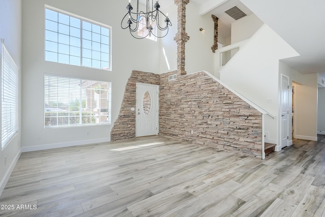 31259 N 42nd Pl, Cave Creek, AZ 85331 - unfurnished living room with a high ceiling, a chandelier, and wood finished floors