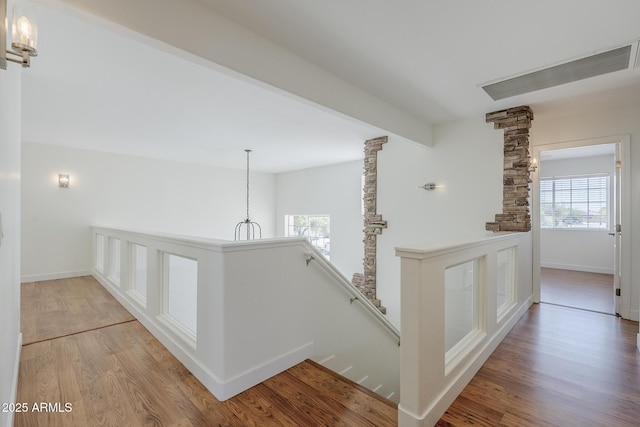 31259 N 42nd Pl, Cave Creek, AZ 85331 - hallway with wood finished floors, an upstairs landing, and ornate columns