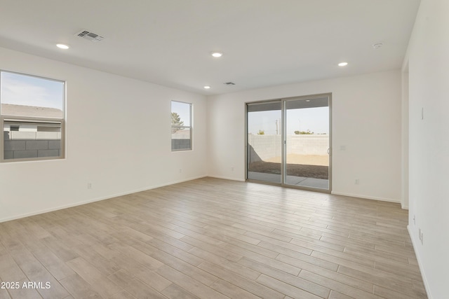 unfurnished room featuring light hardwood / wood-style flooring