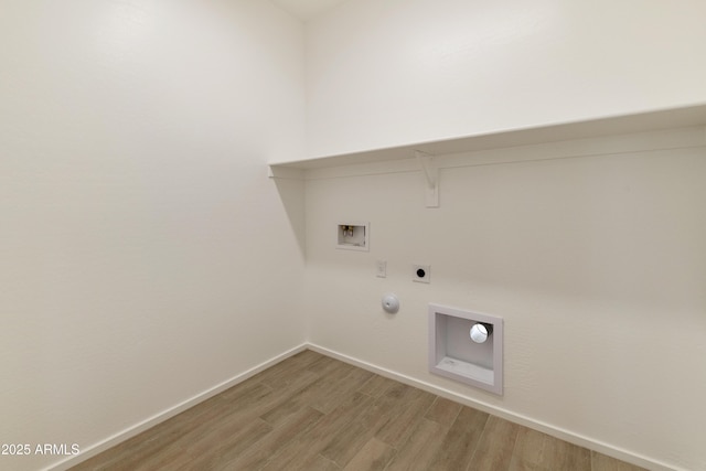 clothes washing area with hookup for an electric dryer, washer hookup, hookup for a gas dryer, and wood-type flooring