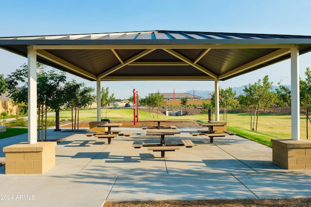 surrounding community featuring a gazebo, a patio, and a lawn