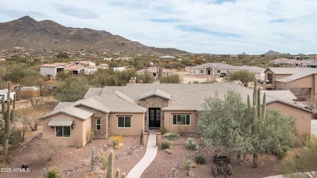 ranch-style house featuring a mountain view