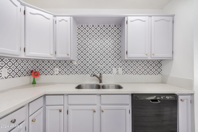 kitchen with white cabinetry, sink, and black dishwasher