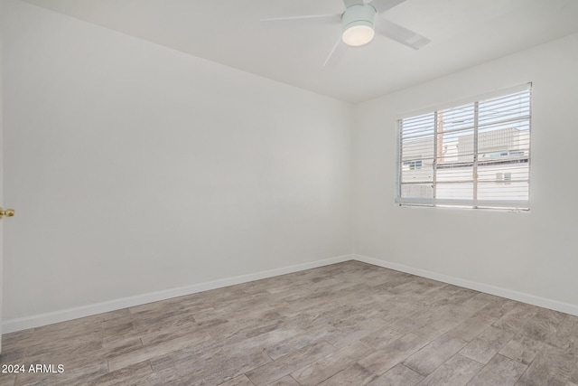 unfurnished room featuring light wood-type flooring and ceiling fan