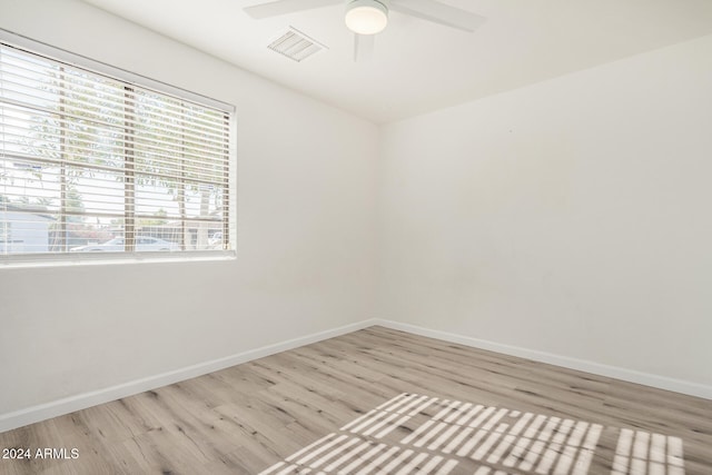 empty room featuring light hardwood / wood-style flooring and ceiling fan