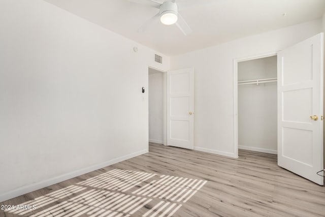 1818 E Monterey Way, Phoenix, AZ 85016 - unfurnished bedroom featuring light wood finished floors, a closet, and ceiling fan