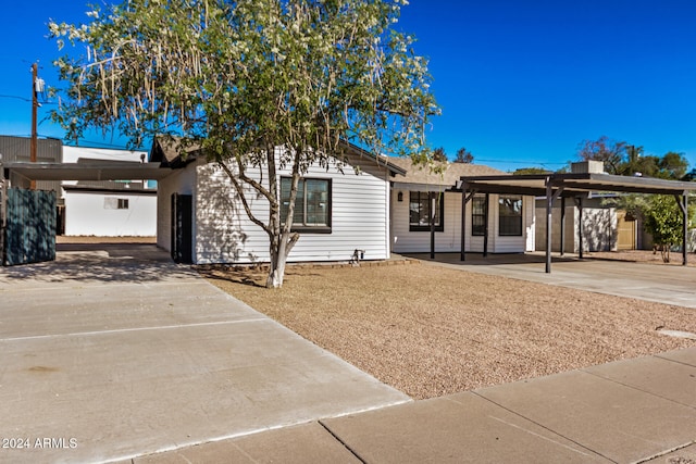 view of front of home with a carport