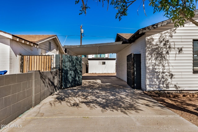 view of side of property with a carport