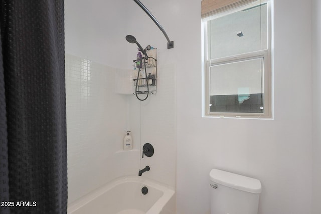 bathroom featuring bathing tub / shower combination and toilet