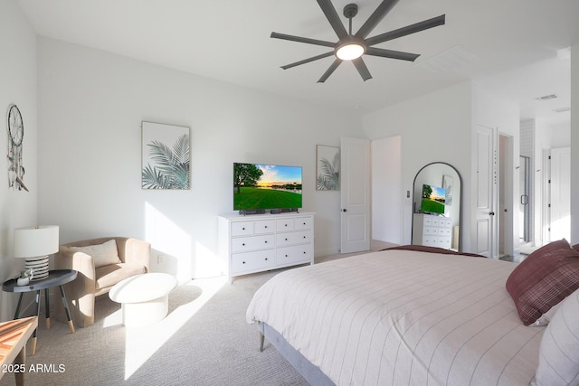 bedroom featuring light colored carpet and ceiling fan