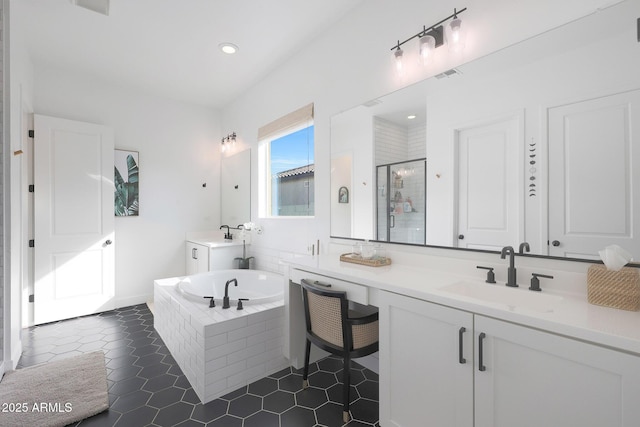 bathroom featuring tile patterned floors, separate shower and tub, and vanity