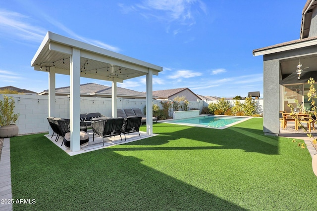 view of yard featuring a fenced in pool and a patio area