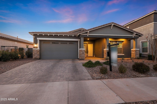 view of front of property with a garage