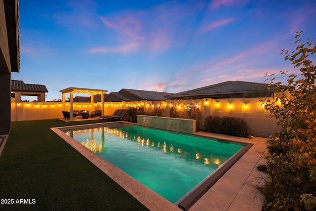 pool at dusk with a patio