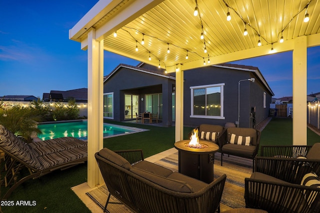 exterior space featuring an outdoor living space with a fire pit