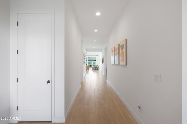 hall with light hardwood / wood-style flooring