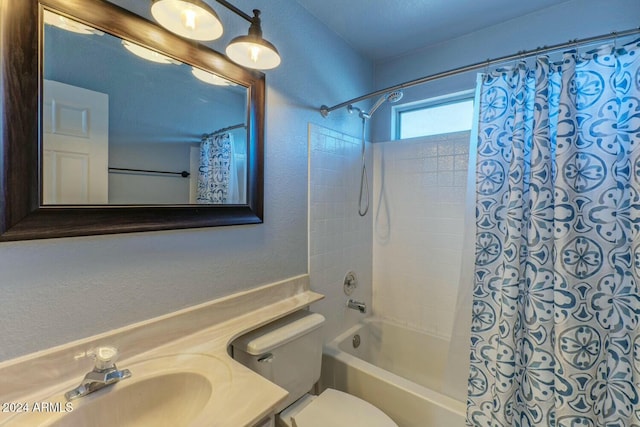 full bathroom with shower / tub combo, vanity, and toilet